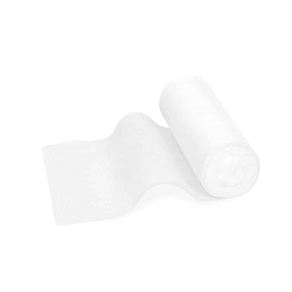 Un rouleau de bande de fixation élastique Meditrade ABE® - différentes tailles, partiellement déroulé, posé sur un simple fond blanc. Le papier est doux et a une texture de bande de fixation élastique.