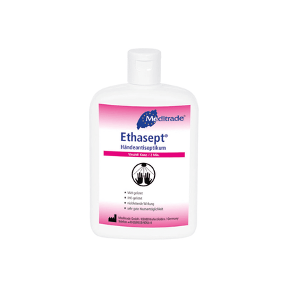 Une bouteille de désinfectant pour les mains Meditrade Ethasept® de Meditrade GmbH avec une étiquette blanc-rose. Le produit est censé contenir 70 % d'alcool, être doux pour la peau et avoir un effet antibactérien.