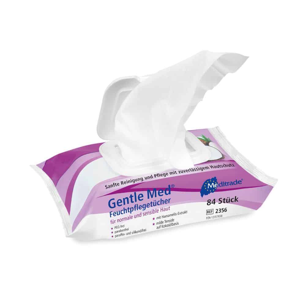 Un paquet de lingettes humides Meditrade Gentle Med® (80 lingettes) de Meditrade GmbH, avec une lingette retirée. L'emballage blanc-violet convient aux peaux normales/sensibles et est idéal pour un nettoyage doux de la peau.