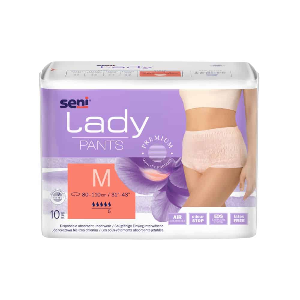 Un emballage de sous-vêtements absorbants Seni Lady Pants en taille Medium, développé pour l'incontinence, montre une image du produit sur un modèle féminin. L'emballage met en avant des caractéristiques telles que la respirabilité et la sécurité. Le produit est de TZMO Deutschland GmbH.