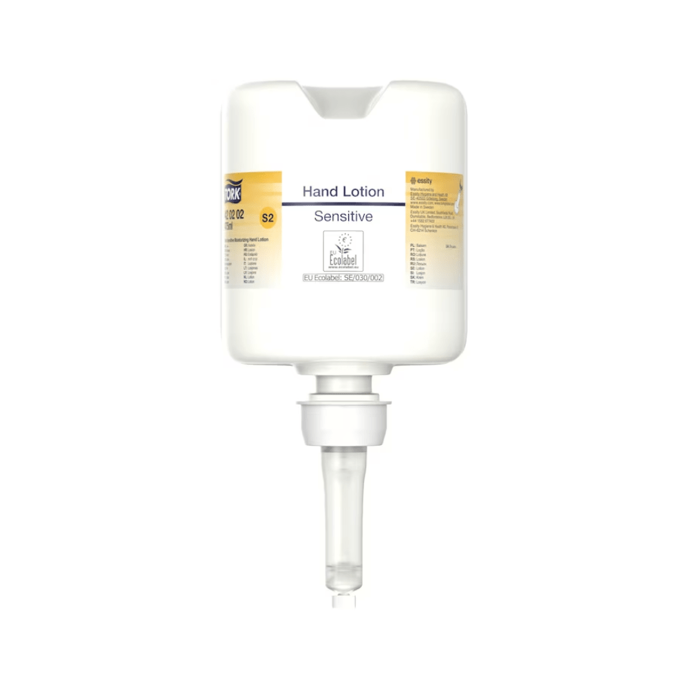 Un distributeur de lotion pour les mains Tork 420202 en blanc avec une buse transparente et l'inscription « Désinfection des mains hydratante sensible » en petites lettres offre un design minimaliste, axé sur la distribution de lotion hydratante, parfait pour le soin des peaux sensibles.