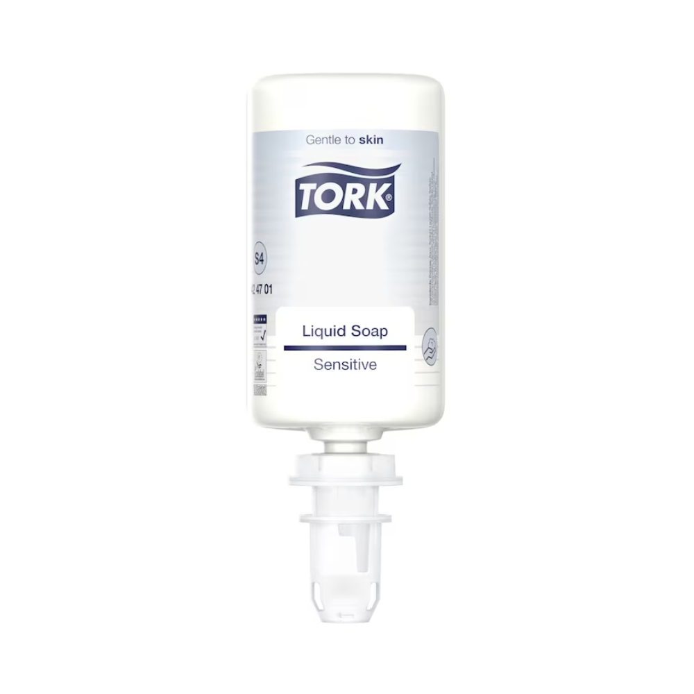 Une bouteille blanche de savon liquide sensible Tork 424701 1000 ml est visible devant un fond simple. L'étiquette met en avant les propriétés respectueuses de la peau, ce qui rend le savon idéal pour les peaux sensibles. La bouteille est équipée d'un bec doseur et souligne son effet doux avec des ingrédients naturels.