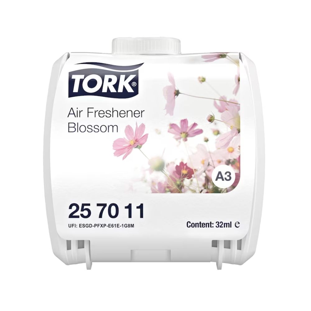 Ein weißer Lufterfrischer von TORK, bekannt als „Kontinuierlicher Lufterfrischer“ mit einem Blumendesign aus rosa und weißen Blumen und der Aufschrift „Air Freshener Blossom“. Das Produkt hat den Code 25 70 11, ist in der Größe 32 ml erhältlich und mit einem UFI-Code versehen.