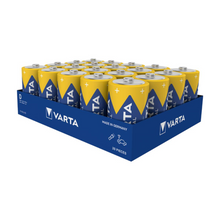 Un plateau bleu contient 20 piles Varta Industrial 4014 Pro Baby C LR14 1,5V de Varta AG avec des couvercles jaunes, des étiquettes bleues et le logo Varta. Sur le plateau, il est écrit "20 pièces", "fabriqué en Allemagne" et la compatibilité de la batterie Baby C.