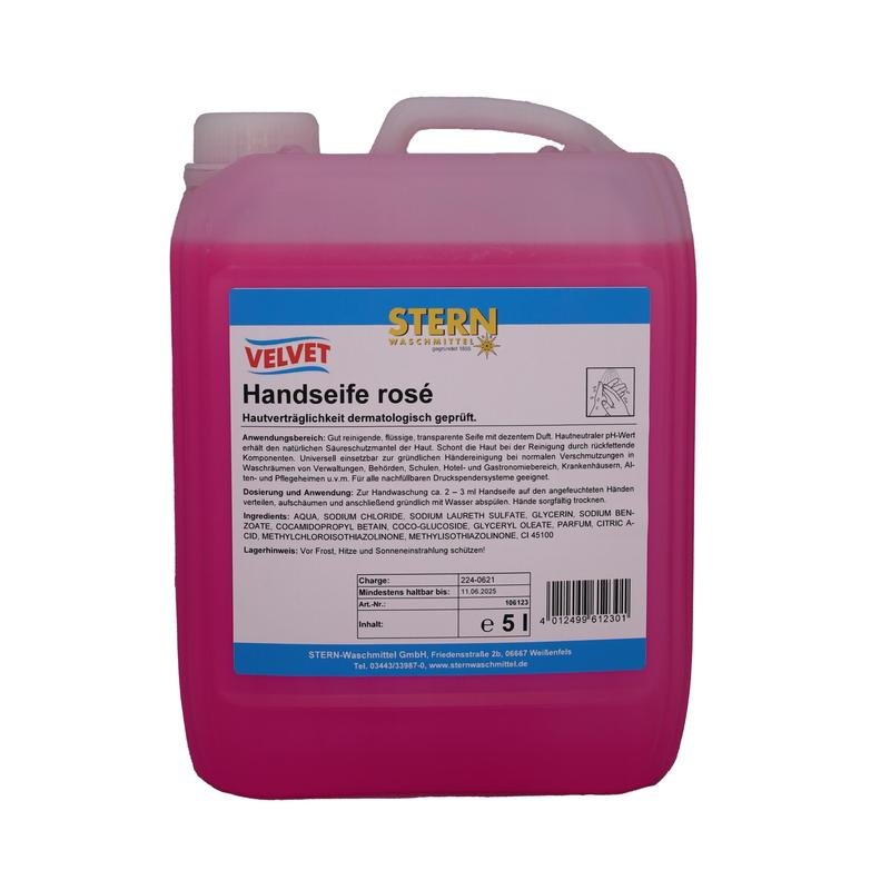 Le bidon en plastique de 5 litres de savon pour les mains Velvet rose de Stern Waschmittel GmbH a un design rose, un couvercle blanc et une étiquette bleu-blanc avec des informations sur le produit et les ingrédients.
