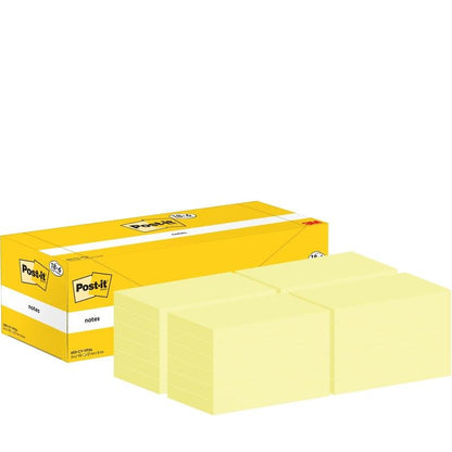 Une boîte jaune avec des notes autocollantes Post-it® (76 mm x 127 mm, 100 feuilles/bloc, 18 blocs + 6 gratuits) de 3M Deutschland GmbH est illustrée avec des blocs de notes autocollantes jaunes soigneusement empilés; l'emballage montre le logo Post-it et les détails du produit.